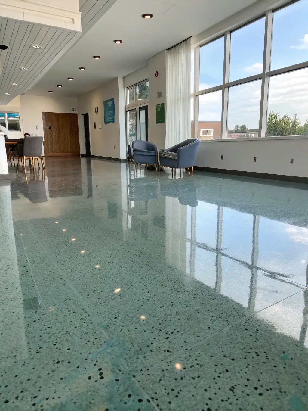 A sleek, modern interior with hardwood flooring, elegant ceiling design, and refined finishing touches, emphasizing attention to detail.